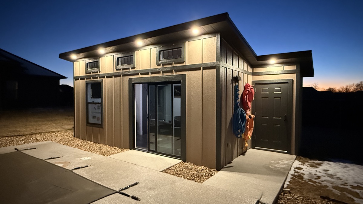 Modern pool house exterior with board and batten siding