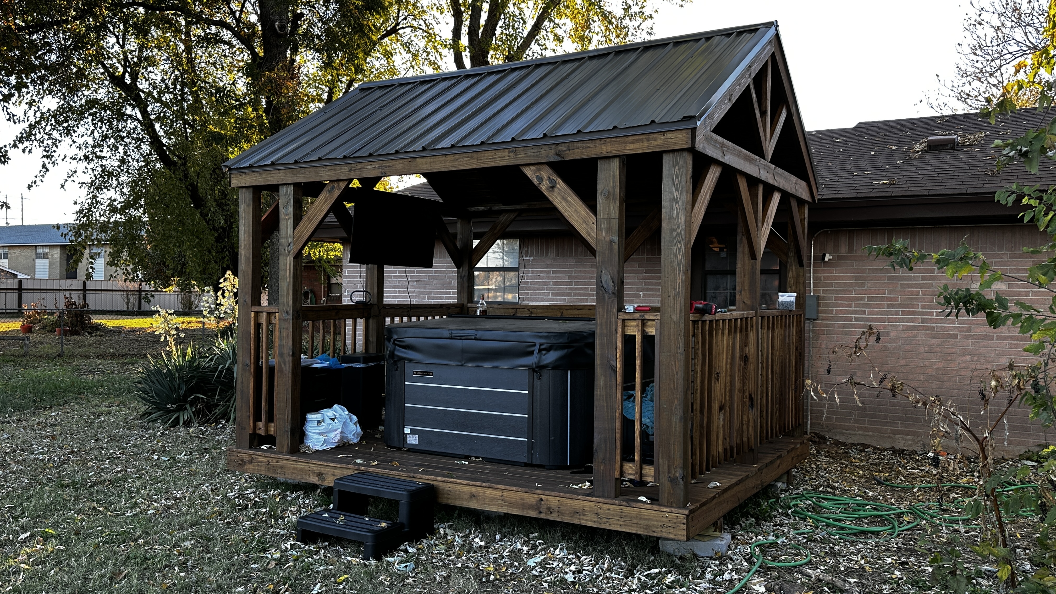 Custom wood pavilion with metal roof by Barn Brothers